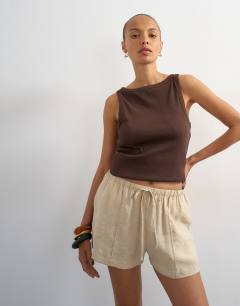 Model wearing Tie waist seam detail shorts in stone