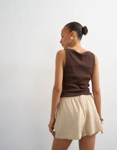 Model wearing Tie waist seam detail shorts in stone