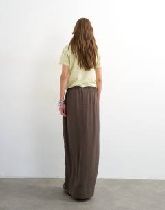 Model wearing Tie waist slouchy slim maxi skirt in chocolate