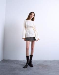 Model wearing Tie waist top in ecru