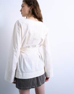 Model wearing Tie waist top in ecru