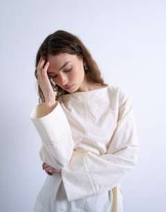 Model wearing Tie waist top in ecru