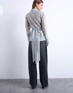 Model wearing Tie waisted sheer shirt in blue stripe