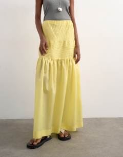 Model wearing Tiered crinkle maxi skirt in yellow