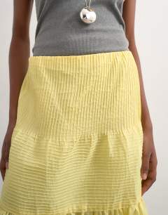 Model wearing Tiered crinkle maxi skirt in yellow