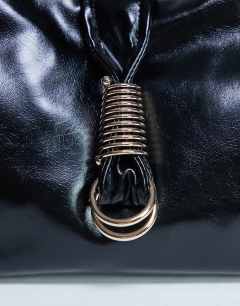 Model wearing Tilly metal hardware slouchy tote bag in black