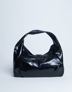 Model wearing Tilly metal hardware slouchy tote bag in black