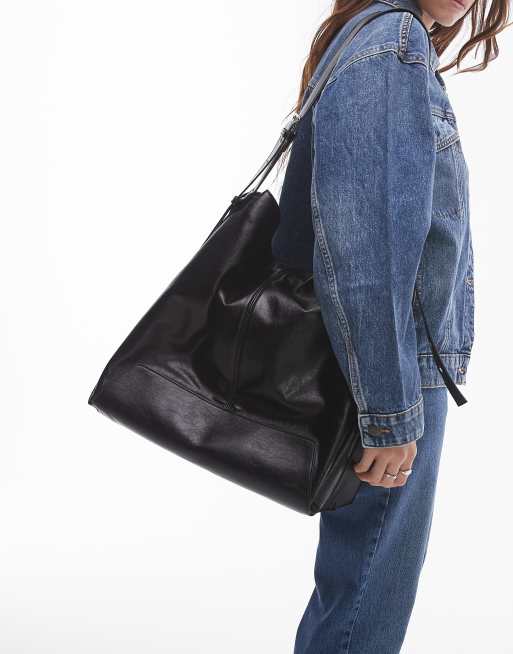 Topshop – Tilly – Oversize-Tragetasche in Schwarz mit gefaltetem Detail und Schnallenverzierung