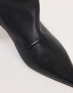 Model wearing Tina real leather kitten heel knee boot in black