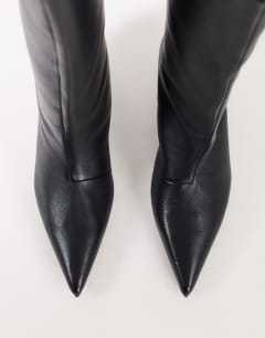 Model wearing Tina real leather kitten heel knee boot in black