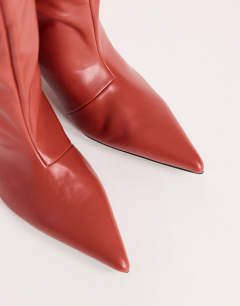 Model wearing Tina real leather kitten heel knee boot in red