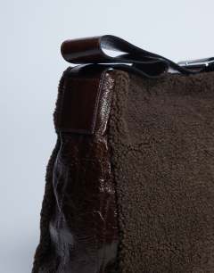 Model wearing Tish shealing tote bag with contrast strap in chocolate