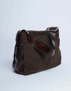Model wearing Tish shealing tote bag with contrast strap in chocolate