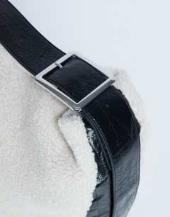 Model wearing Tish shealing tote bag with contrast strap in cream & black