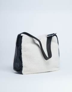 Model wearing Tish shealing tote bag with contrast strap in cream & black