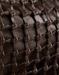 Model wearing Tobias large woven tote bag in chocolate