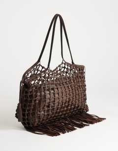 Model wearing Tobias large woven tote bag in chocolate