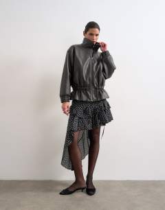 Model wearing Toggle waist leather look funnel zip through jacket in black