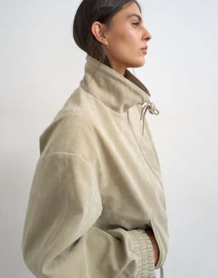 Toggle waist leather look zip through jacket in taupe