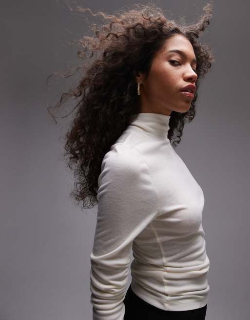 Topshop - Top premium a maniche lunghe accollato crema trasparente