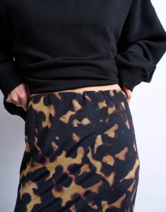 Model wearing Tortoise shell print mesh maxi skirt in black