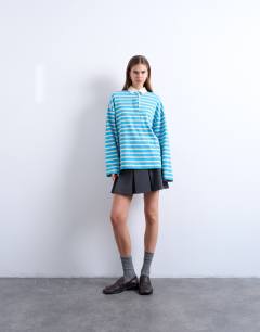 Model wearing Towelling stripe long sleeve polo in blue