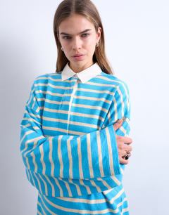 Model wearing Towelling stripe long sleeve polo in blue