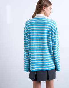 Model wearing Towelling stripe long sleeve polo in blue