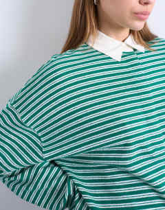 Model wearing Towelling stripe long sleeve polo in green