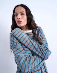 Model wearing Towelling stripe skater tee in blue