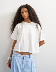Model wearing Trapeze tee in ecru