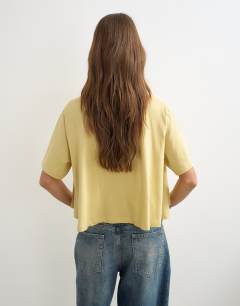 Model wearing Trapeze tee in yellow