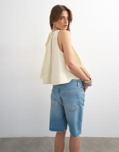Model wearing Trapeze tie back top in ecru