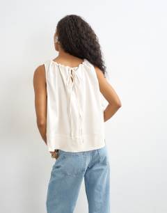 Model wearing Trapeze tie back top in ecru