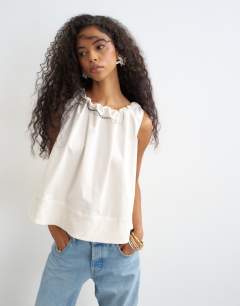 Model wearing Trapeze tie back top in ecru