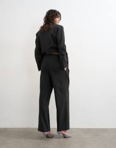 Model wearing Triple pleat trouser in black