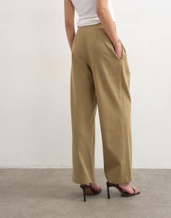 Model wearing Triple pleat trouser in neutral