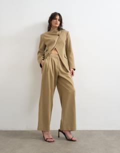 Model wearing Triple pleat trouser in neutral