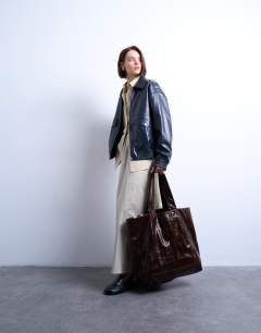 Model wearing Troy crinkle tote bag in chocolate
