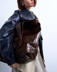 Model wearing Troy crinkle tote bag in chocolate