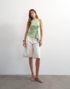 Model wearing Tuck side asym hem top in sage