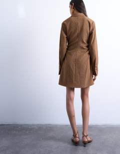 Model wearing Tuck side shirt dress in mini brown check