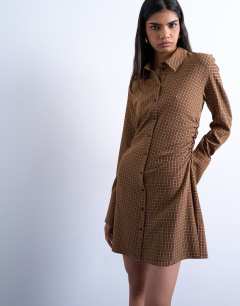 Model wearing Tuck side shirt dress in mini brown check