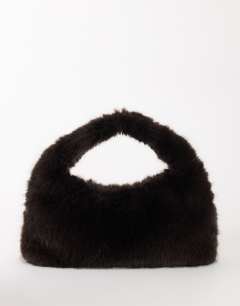 Model wearing Tully large faux fur shoulder bag in chocolate