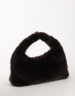 Model wearing Tully large faux fur shoulder bag in chocolate