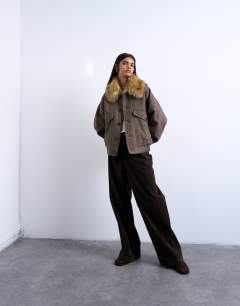 Model wearing Twill bomber with faux fur collar with wool in brown