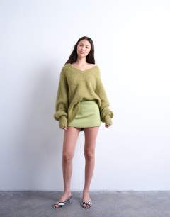 Model wearing Twill clean skort in avocado green