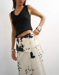 Model wearing Twill wrap tie detail maxi skirt in cow print