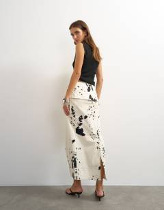 Model wearing Twill wrap tie detail maxi skirt in cow print