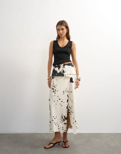 Model wearing Twill wrap tie detail maxi skirt in cow print